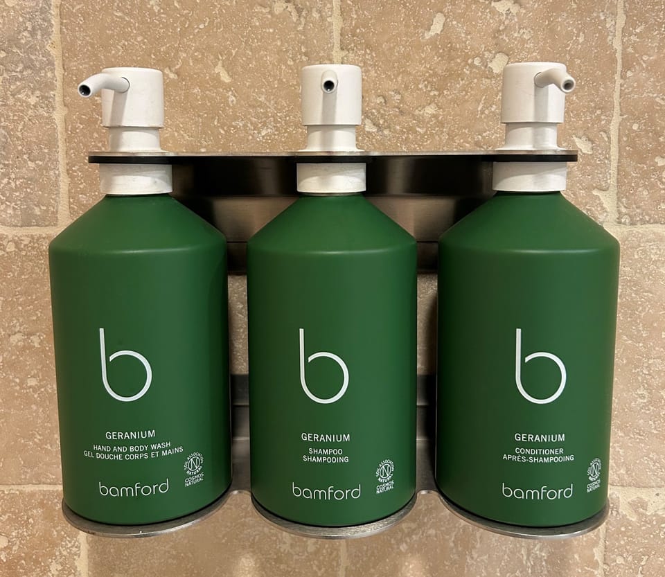 Shower, designer toiletries, hair dryer, bathrobes