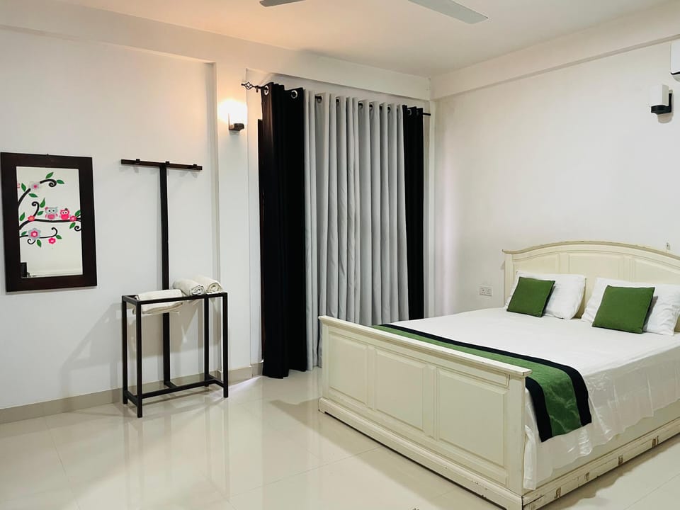 Family Room | Premium bedding, desk, laptop workspace, iron/ironing board