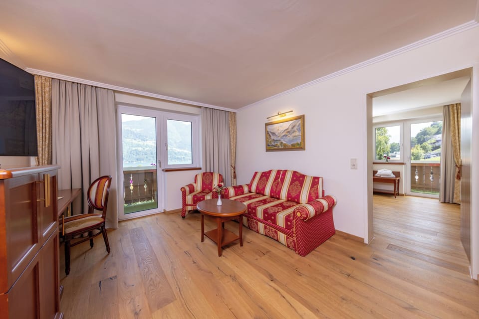 Suite, 1 Double Bed, Balcony, Lake View | Living area | Flat-screen TV