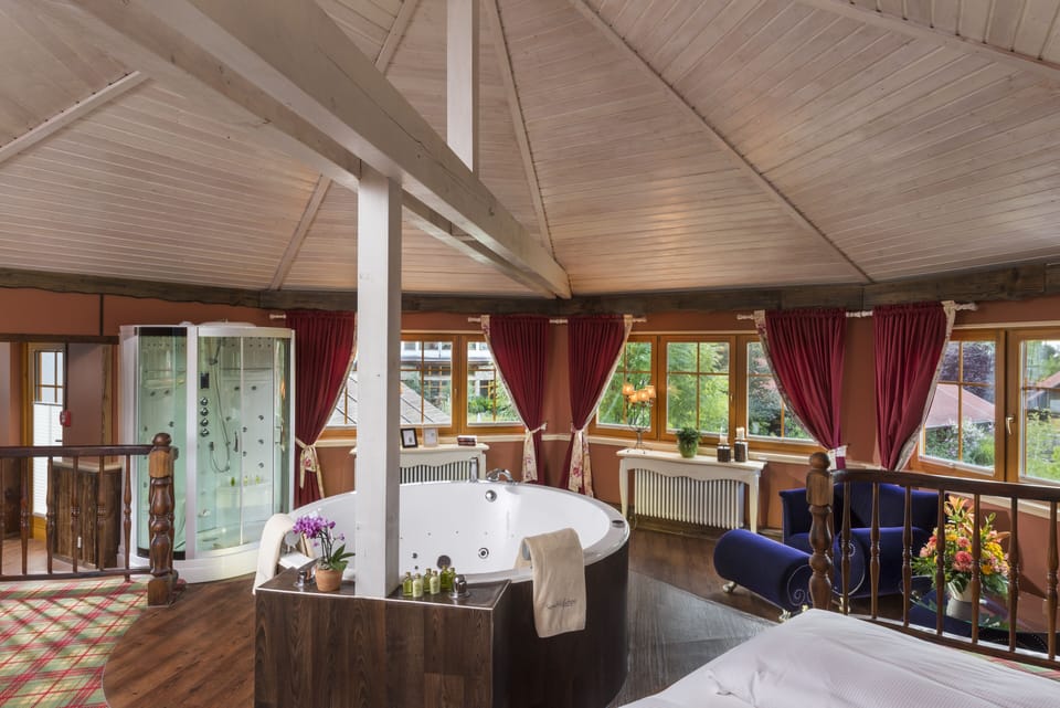Superior Suite, 1 King Bed, Hot Tub, Lake View | Minibar, in-room safe, desk, blackout drapes