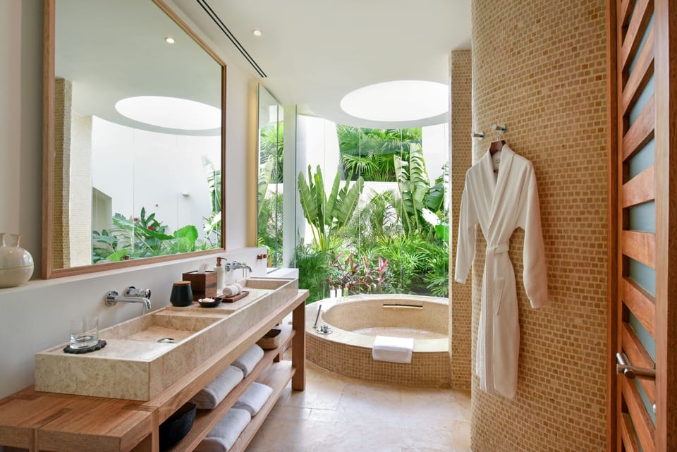 Separate tub and shower, rainfall showerhead, designer toiletries