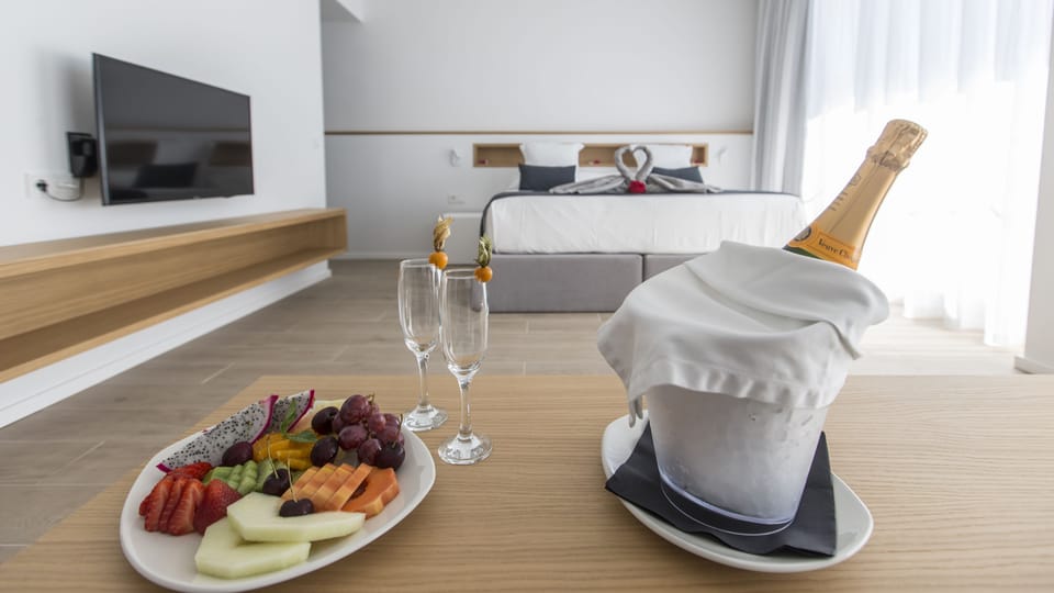 Suite, Pool View | Premium bedding, down comforters, memory foam beds, minibar