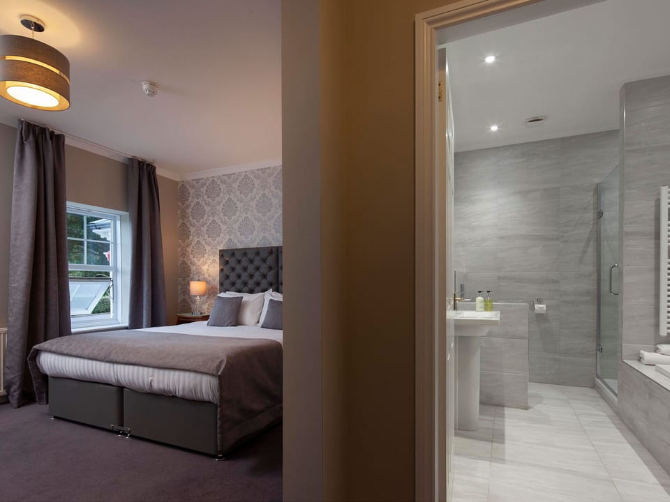 Family Room | Desk, iron/ironing board, bed sheets