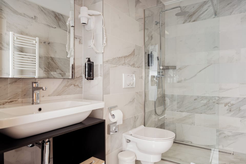 Shower, free toiletries, hair dryer, slippers