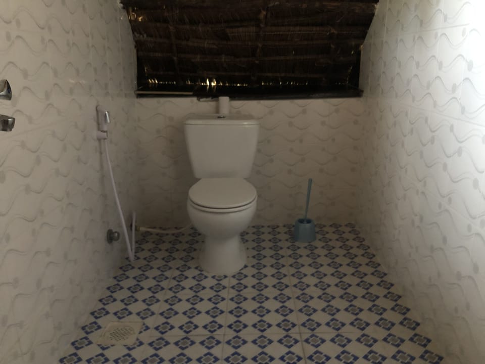 Basic Bungalow, 1 Double Bed, Beach View | Bathroom | Shower, free toiletries, towels, soap
