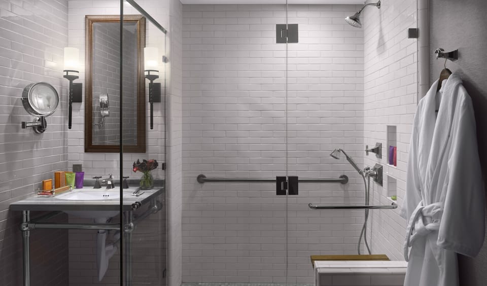 Shower, designer toiletries, hair dryer, bathrobes