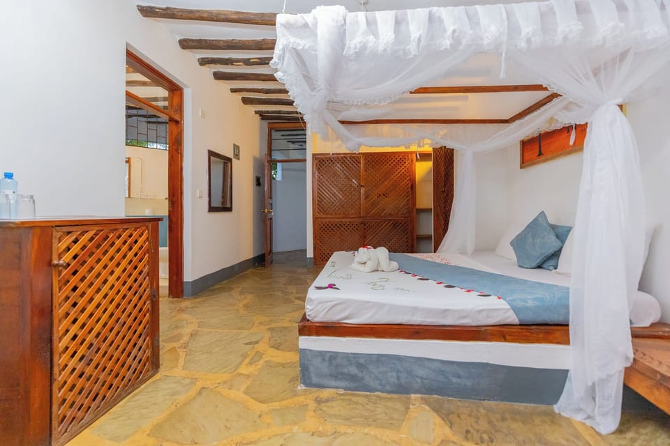 Standard Double Room, Garden View, Beachside | Laptop workspace, blackout drapes, free WiFi, bed sheets