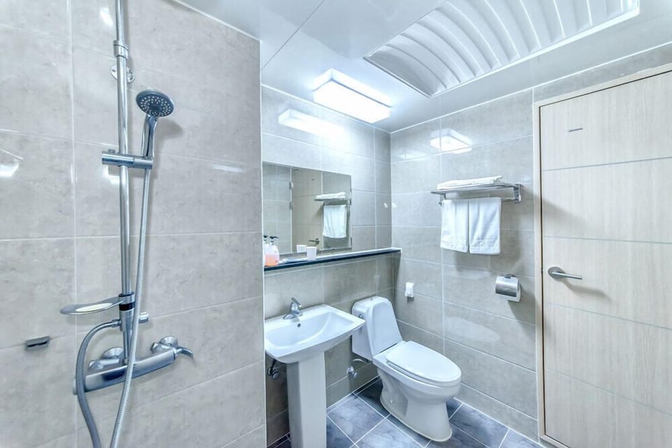 Shower, free toiletries, hair dryer, slippers