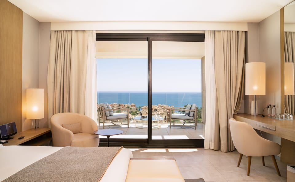 The Oasis Room, Terrace, Sea View | Down comforters, minibar, in-room safe, desk
