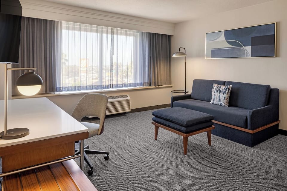 Suite, 1 King Bed with Sofa bed | Living area | 32-inch Smart TV with cable channels, TV, Netflix