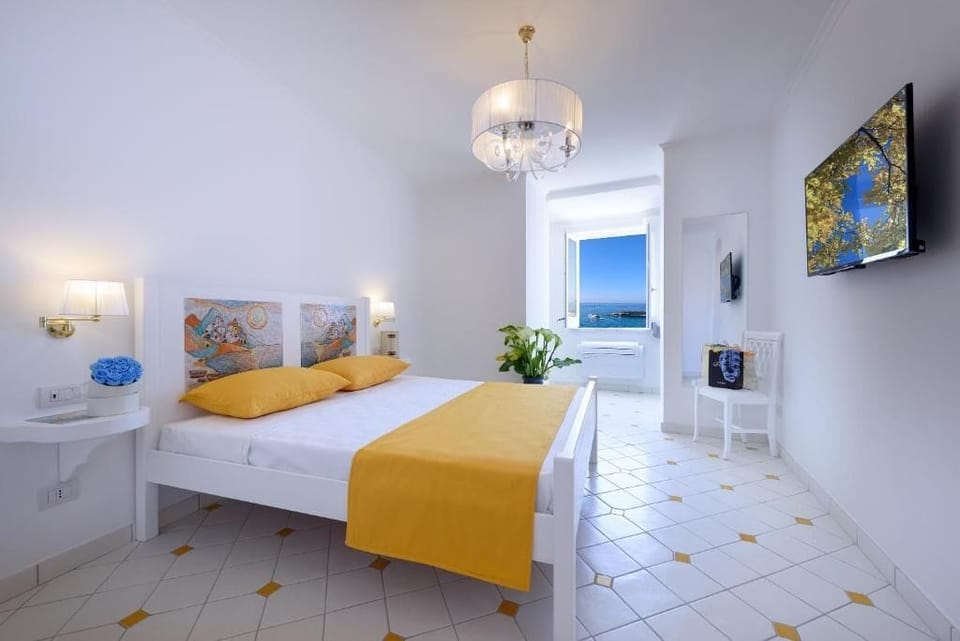 Deluxe Triple Room, Sea View | Frette Italian sheets, premium bedding, down comforters, pillowtop beds