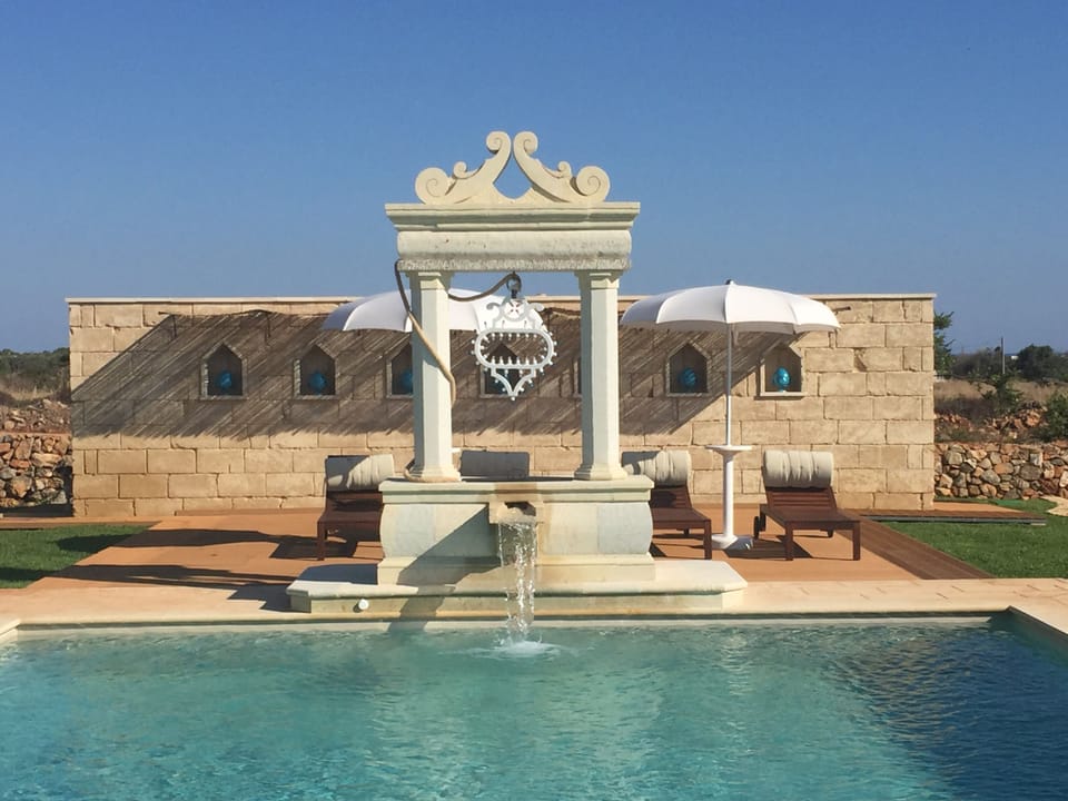 Seasonal outdoor pool, a waterfall pool, free cabanas, pool umbrellas