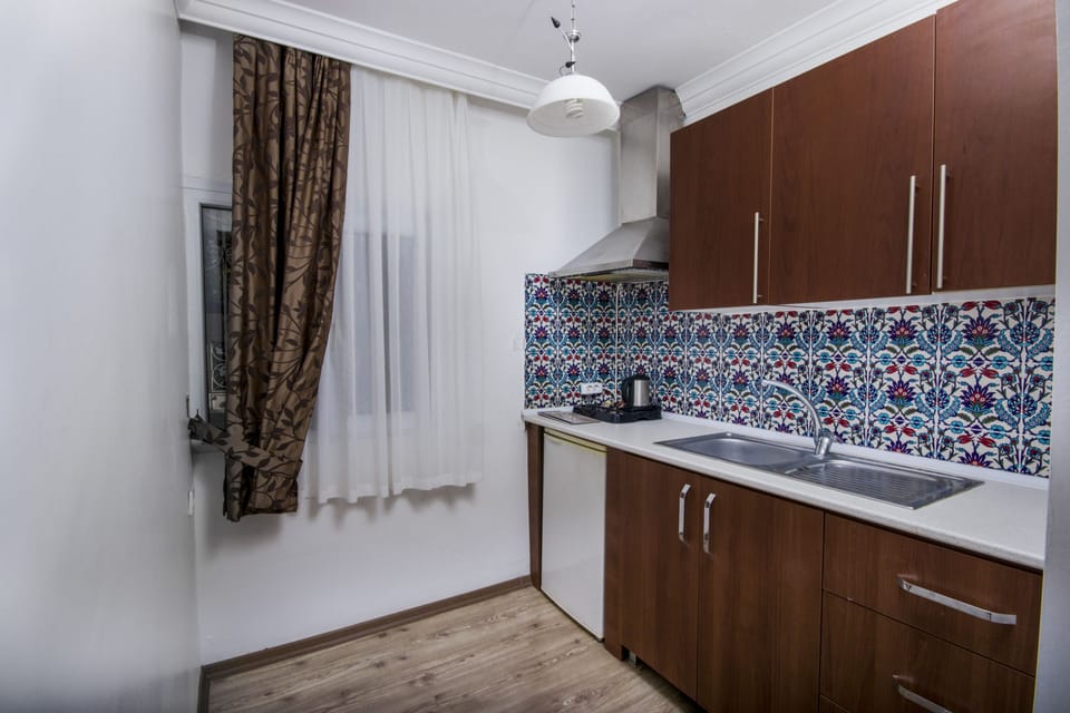 Grand Suite, 2 Bedrooms | Living area | Flat-screen TV
