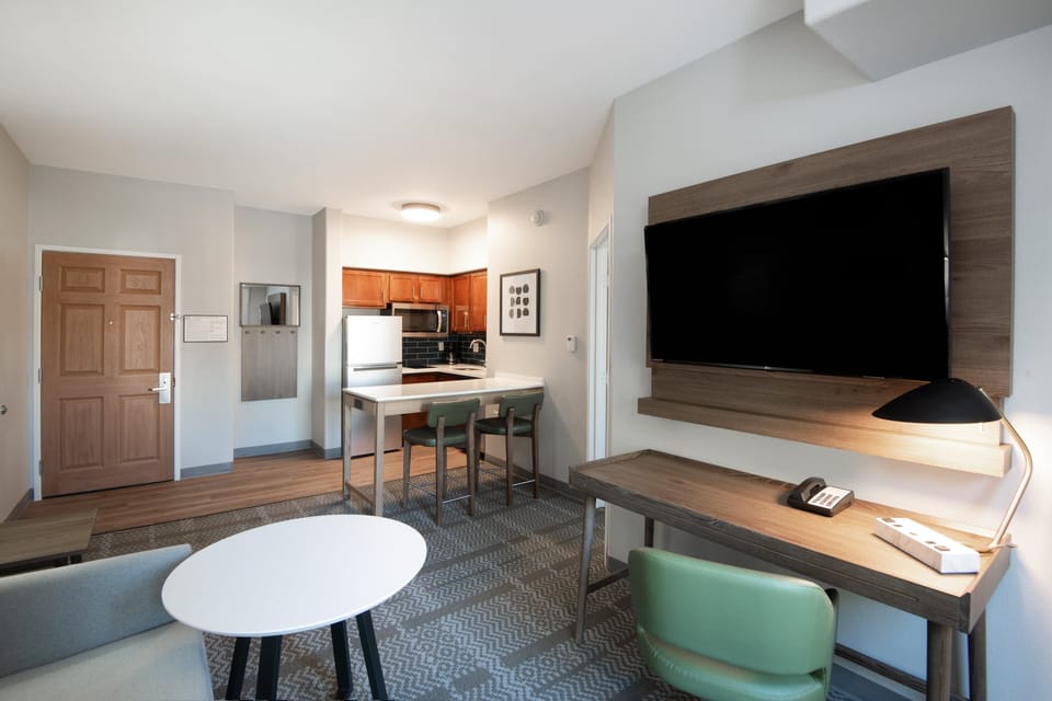 Desk, laptop workspace, blackout drapes, iron/ironing board