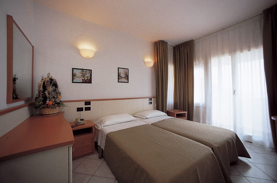 Standard Double or Twin Room | Minibar, desk, blackout drapes, bed sheets