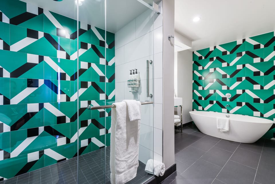 Designer toiletries, hair dryer, bathrobes, towels
