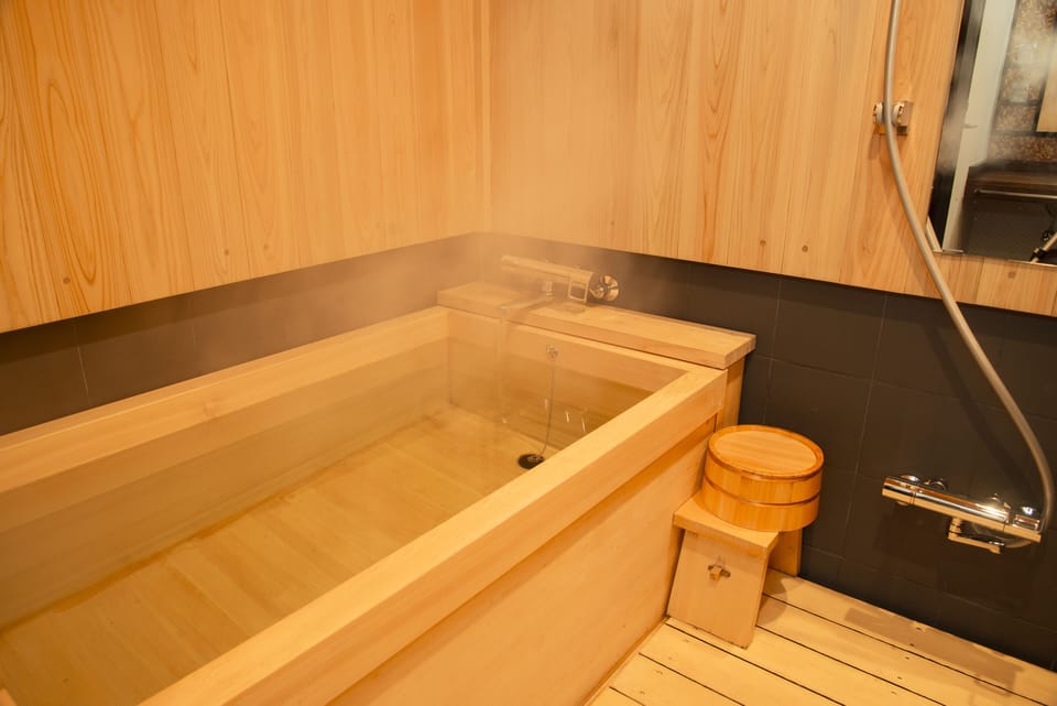 Combined shower/tub, free toiletries, hair dryer, slippers