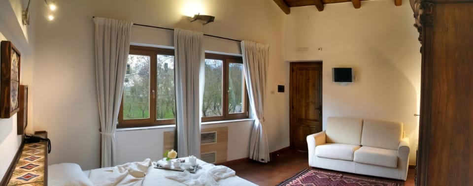 Family Room | Free minibar, in-room safe, iron/ironing board, free WiFi