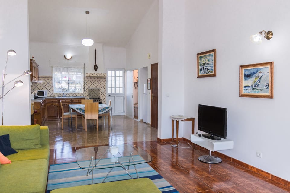 Family Apartment, 2 Bedrooms, Ocean View, Beachfront | Living area | 32-inch LED TV with cable channels, TV