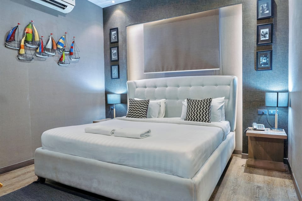 Deluxe Double Room, Private Bathroom | In-room safe, individually decorated, blackout drapes, free WiFi