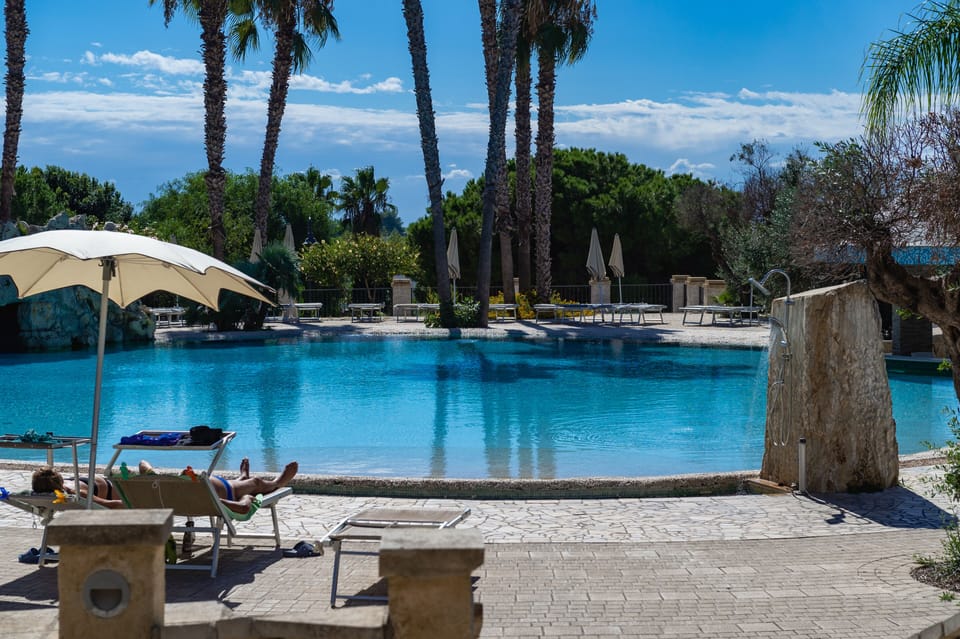Seasonal outdoor pool, open 9:00 AM to 7:00 PM, pool umbrellas