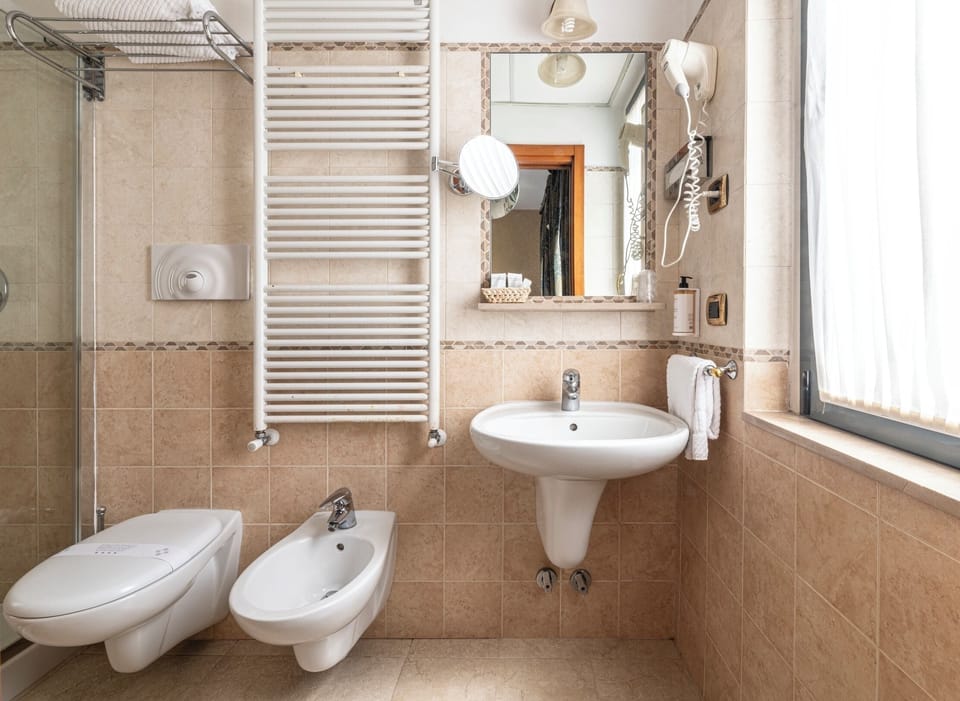 Shower, free toiletries, hair dryer, slippers
