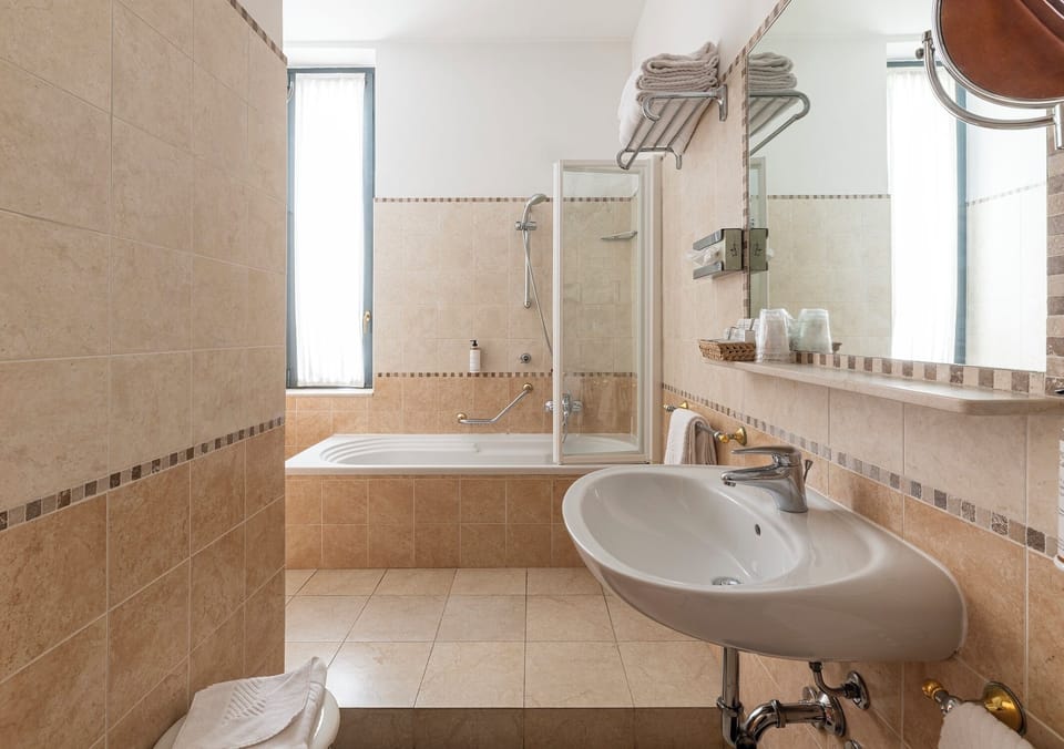 Shower, free toiletries, hair dryer, slippers