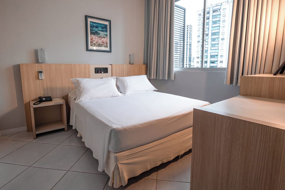 Standard Quadruple Room | Minibar, in-room safe, desk, blackout drapes