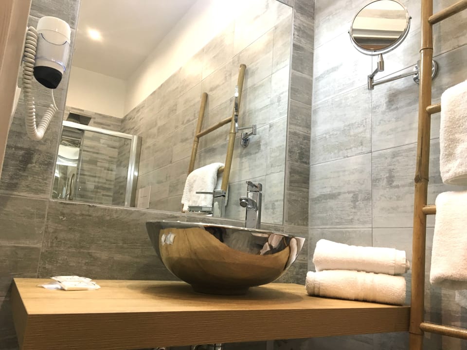 Double Room Single Use | Bathroom | Shower, hair dryer, bathrobes, slippers