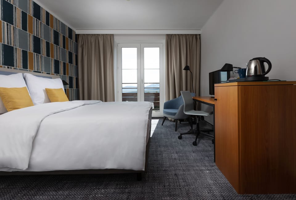 Deluxe Double Room, Balcony | Desk, blackout drapes, soundproofing, free cribs/infant beds