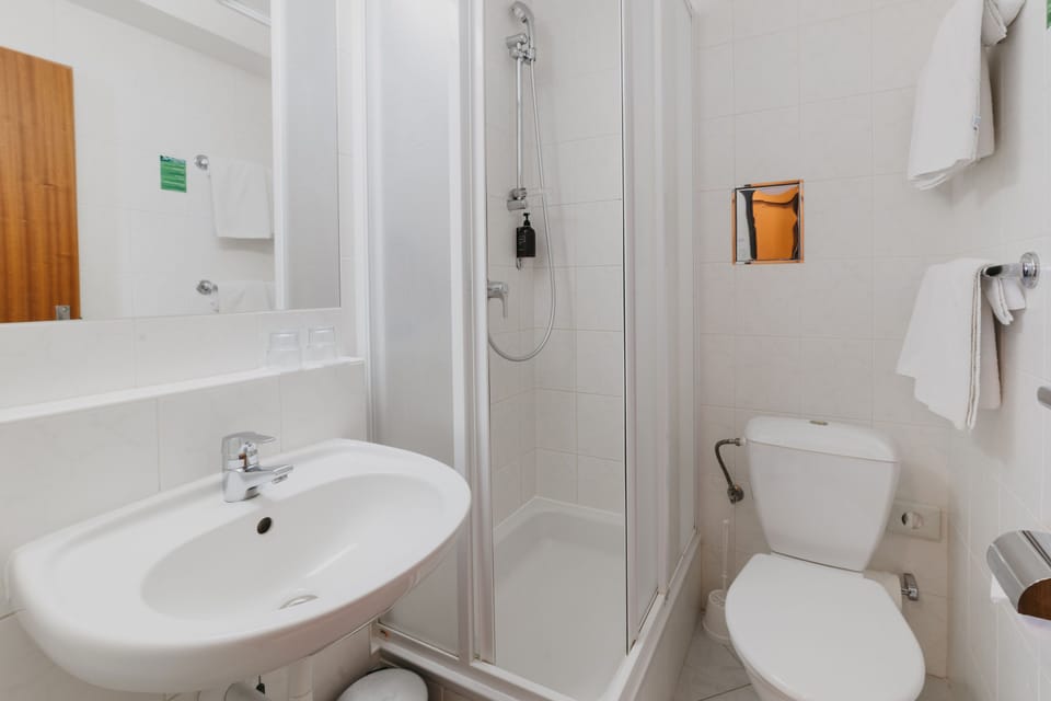 Shower, free toiletries, hair dryer, towels