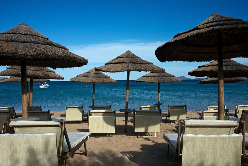 Private beach, white sand, sun loungers, beach umbrellas