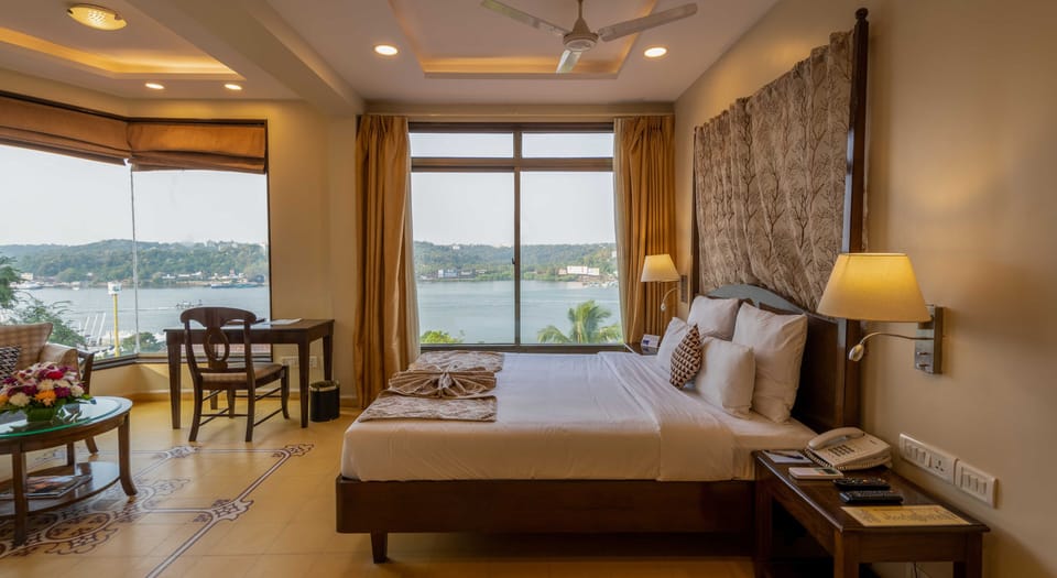 Superior Room, River View | Living area | 32-inch flat-screen TV with satellite channels, TV