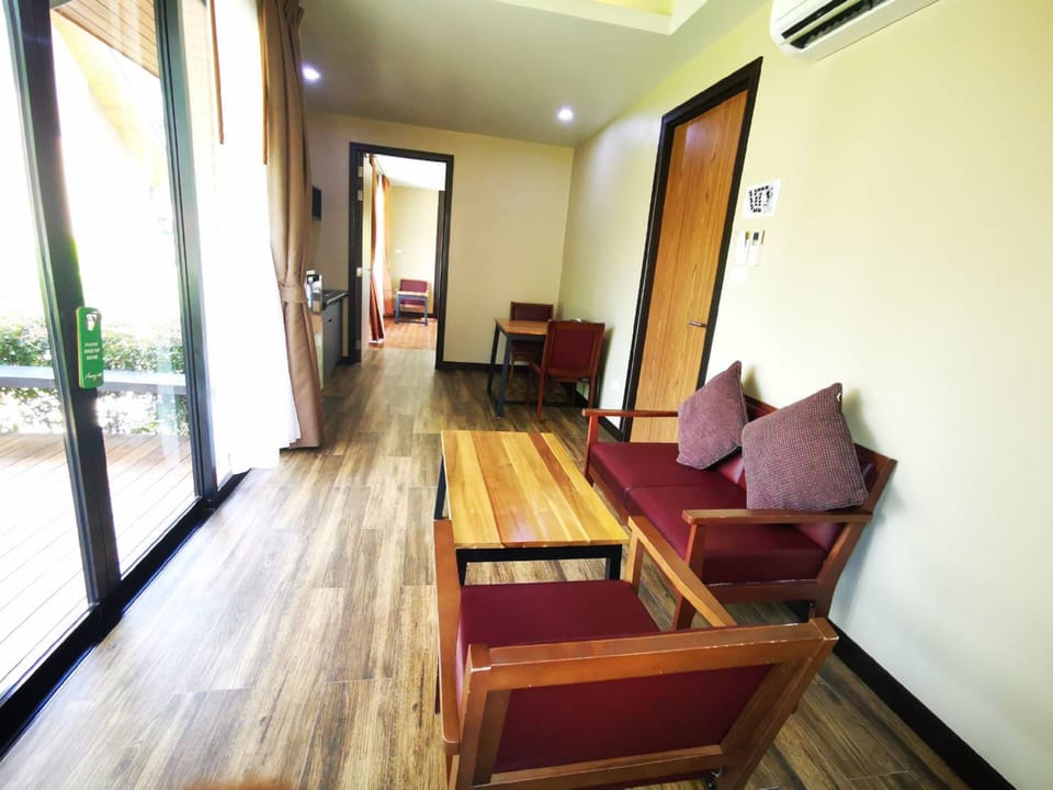 Two Bedroom Villa | Living area | 55-inch flat-screen TV with satellite channels, TV