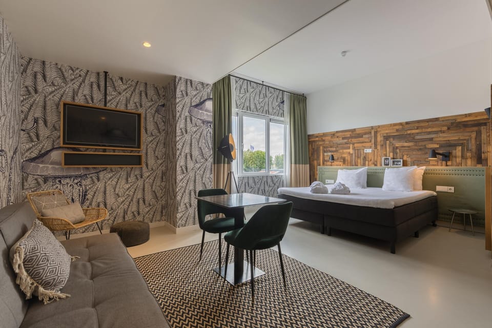 Suite, 1 King Bed | Minibar, in-room safe, desk, iron/ironing board