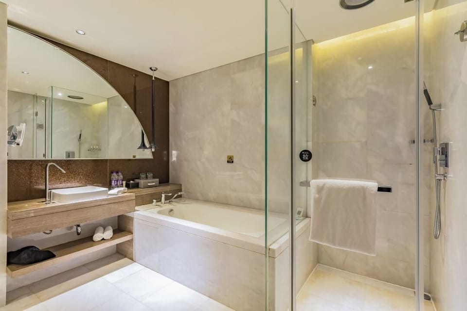 Cosmic Deluxe Room  | Bathroom | Separate tub and shower, free toiletries, hair dryer, bathrobes