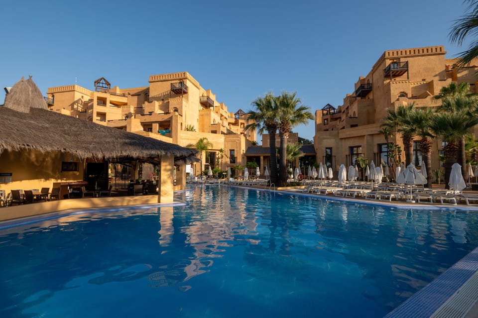Indoor pool, pool umbrellas, sun loungers