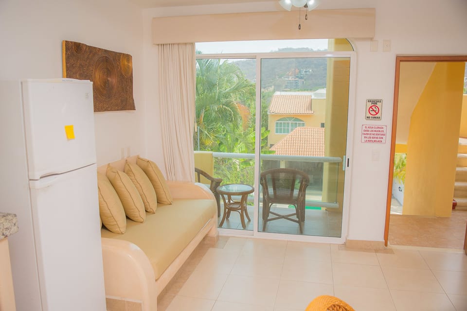 Superior Bungalow, Pool View | Living area | Flat-screen TV