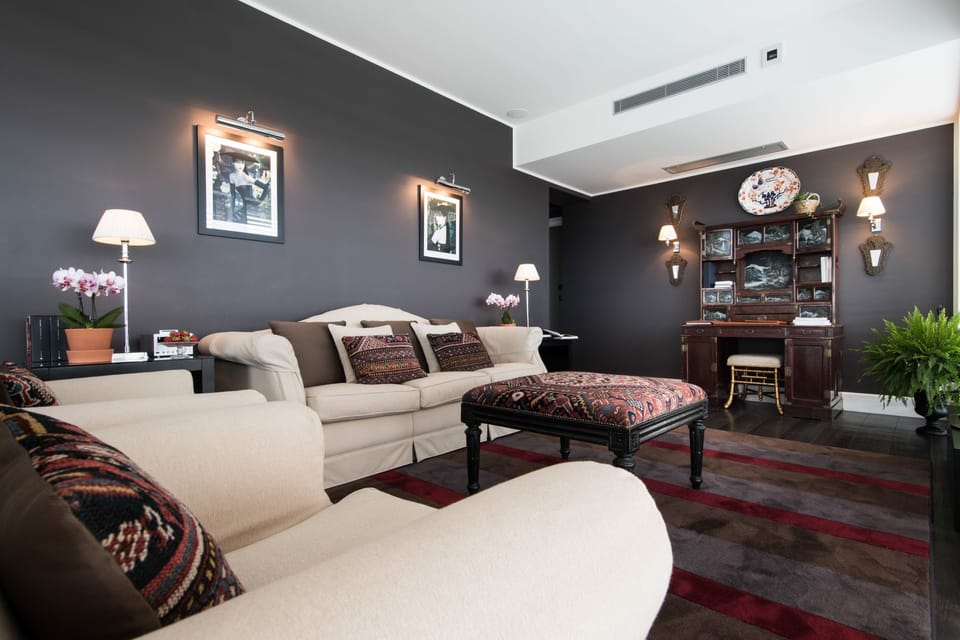 Luxury Penthouse, 1 King Bed, City View | Living room | Flat-screen TV