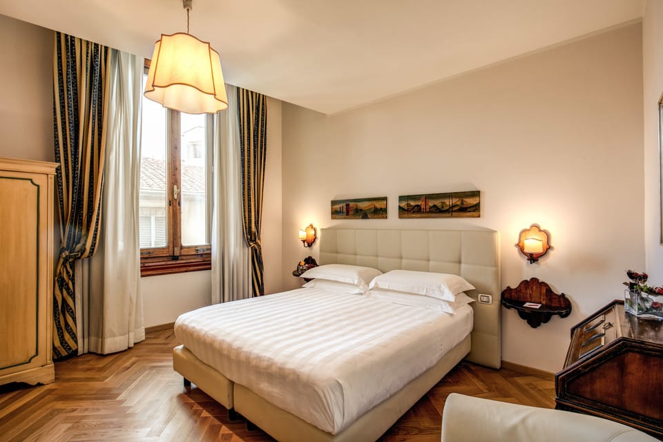 Double or Twin Room | Minibar, in-room safe, desk, iron/ironing board