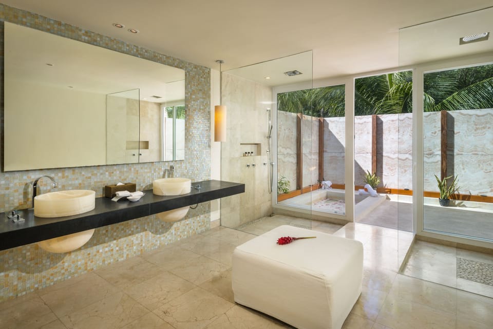 Cenote Lagoon Deluxe Junior Suite | Bathroom | Separate tub and shower, rainfall showerhead, designer toiletries