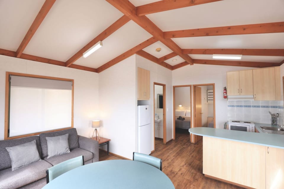 Deluxe Cabin, 2 Bedrooms, Ocean View | Living area | Flat-screen TV