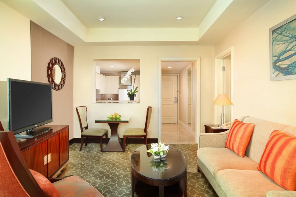 1 Bedroom Apartment | Living area | 49-inch LED TV with cable channels, TV, Netflix