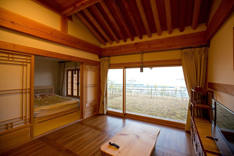 Deluxe Double Room, 1 Double Bed | Living area | TV