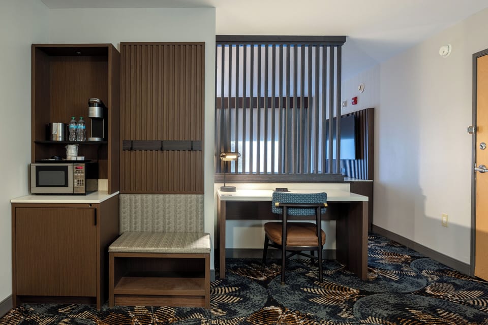 Junior Suite | Living area | 55-inch LCD TV with cable channels, TV