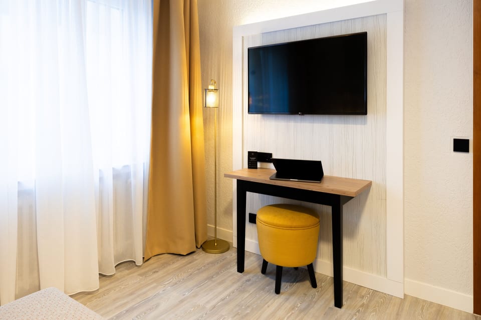 Desk, blackout drapes, cribs (free), WiFi (free)