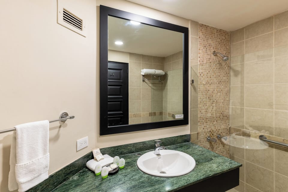 Standard Double Room | Bathroom | Shower, rainfall showerhead, towels, soap