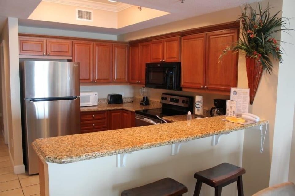 Condo, 2 Bedrooms, Balcony, Beachfront | Private kitchen | Full-size fridge, microwave, oven, stovetop