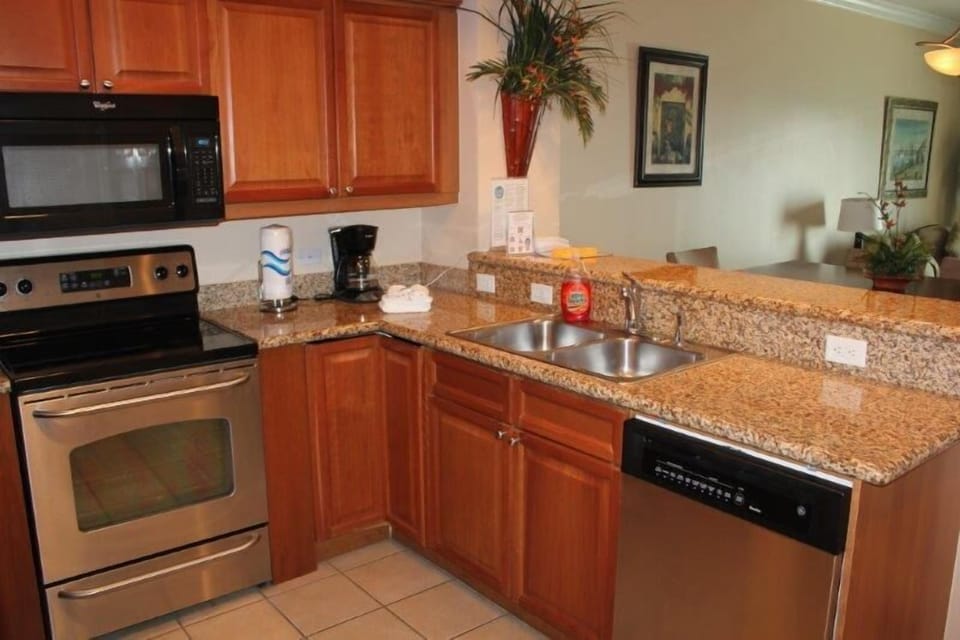 Condo, 2 Bedrooms, Balcony, Beachfront | Private kitchen | Full-size fridge, microwave, oven, stovetop