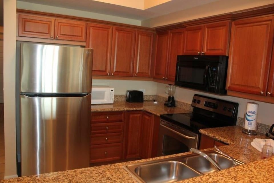 Condo, 2 Bedrooms, Balcony, Beachfront | Private kitchen | Full-size fridge, microwave, oven, stovetop